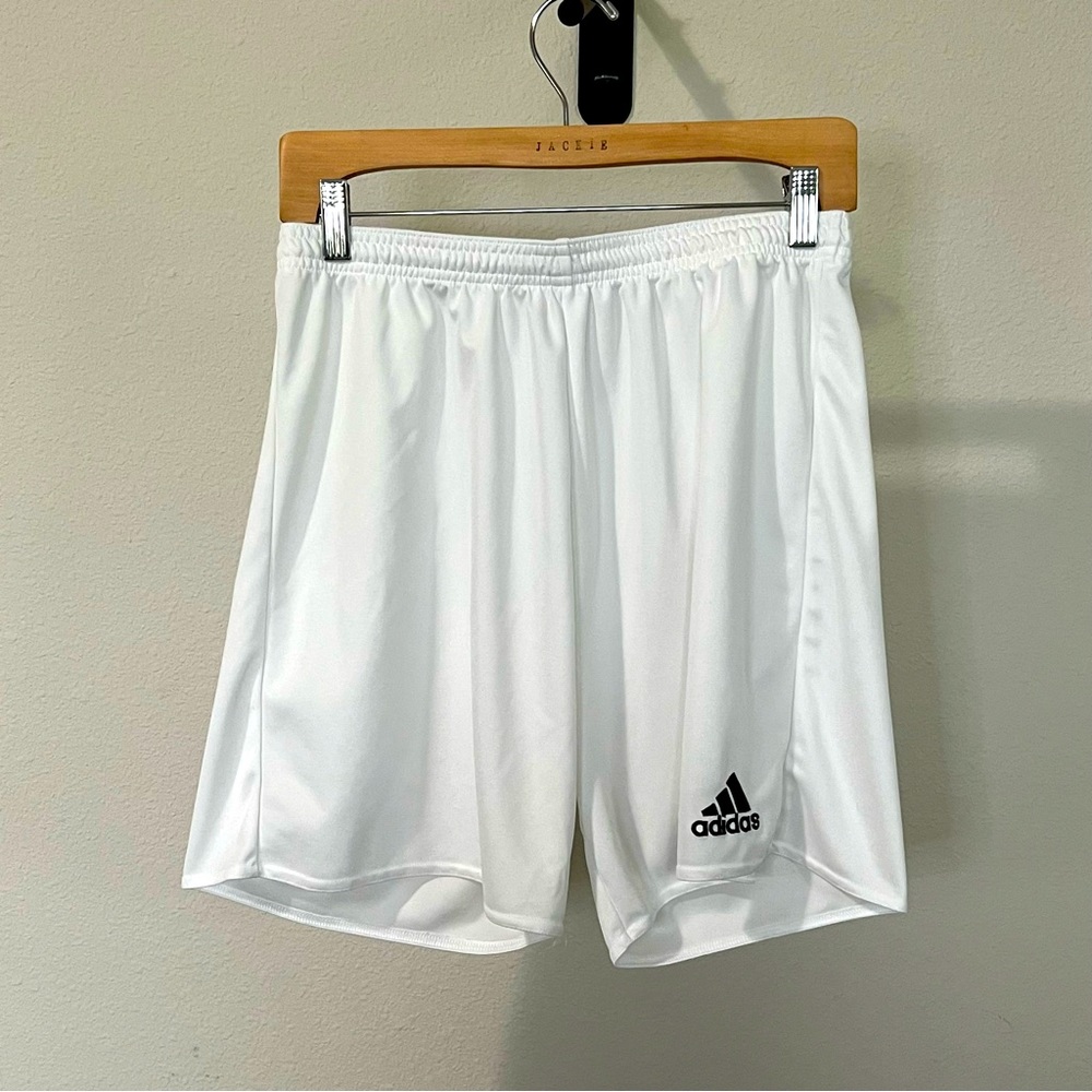 White adidas athletic shorts.